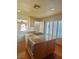Kitchen island with built-in gas cooktop, microwave, and ample cabinet space at 6987 Emerald Springs Ln, Las Vegas, NV 89113
