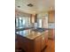 Spacious kitchen with granite countertops, island with gas cooktop, and ample cabinet space at 6987 Emerald Springs Ln, Las Vegas, NV 89113