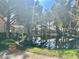 Picturesque pond reflecting nearby homes, creating a serene and inviting community atmosphere at 6987 Emerald Springs Ln, Las Vegas, NV 89113