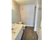 This bathroom offers a vanity, toilet and tiled shower featuring built-in shelving at 7885 W Flamingo Rd # 2153, Las Vegas, NV 89147