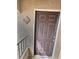 Close-up of the brown front door, unit 2153, with a bronze colored door knob at 7885 W Flamingo Rd # 2153, Las Vegas, NV 89147