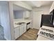 Kitchen with stainless steel sink, modern dishwasher, and views to the living room at 7885 W Flamingo Rd # 2153, Las Vegas, NV 89147