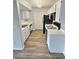 Galley kitchen featuring modern appliances, ample cabinet space, and sleek countertops at 7885 W Flamingo Rd # 2153, Las Vegas, NV 89147