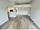 Open-concept living room with neutral paint and modern flooring at 7885 W Flamingo Rd # 2153, Las Vegas, NV 89147