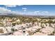 Expansive aerial view of a meticulously planned community with stunning mountain views on a clear sunny day at 7905 Coral Point Ave, Las Vegas, NV 89128