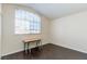 Bedroom with hardwood floors, neutral walls, and a window with blinds at 7905 Coral Point Ave, Las Vegas, NV 89128