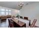 Elegant dining room open to living space with stylish furnishings and decor at 7905 Coral Point Ave, Las Vegas, NV 89128