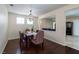 Cozy dining room with chandelier and hardwood floors adjacent to living area at 7905 Coral Point Ave, Las Vegas, NV 89128