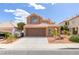 Charming two-story home with a well-manicured lawn and a two-car garage at 7905 Coral Point Ave, Las Vegas, NV 89128