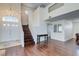 Open-concept living area with stairs, hardwood floors, and plenty of light at 7905 Coral Point Ave, Las Vegas, NV 89128