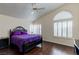 A primary bedroom with hardwood floors, vaulted ceilings, and window shutters at 7905 Coral Point Ave, Las Vegas, NV 89128