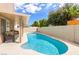 Relaxing backyard pool with a covered patio and comfortable lounge seating for leisure and entertainment at 7905 Coral Point Ave, Las Vegas, NV 89128