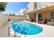 Private backyard pool and patio area with lounge seating, perfect for outdoor enjoyment at 7905 Coral Point Ave, Las Vegas, NV 89128