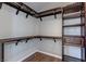 Walk-in closet with custom shelving and hardwood floors at 7905 Coral Point Ave, Las Vegas, NV 89128