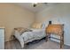 Bedroom featuring a bed with neutral tones, a desk, and cozy carpet at 7919 Mineral Peak St, Las Vegas, NV 89166