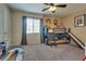 Bright bedroom with bunk beds, slide and a ceiling fan at 7919 Mineral Peak St, Las Vegas, NV 89166