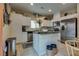 Well-lit kitchen featuring stainless steel appliances and white cabinetry with granite countertops at 7919 Mineral Peak St, Las Vegas, NV 89166