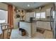 Beautiful kitchen with granite counters, island, stainless appliances, and stylish decor at 7919 Mineral Peak St, Las Vegas, NV 89166