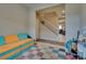 Welcoming open floorplan with tile flooring, stairway to the second floor and neutral paint at 7919 Mineral Peak St, Las Vegas, NV 89166