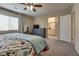 Cozy primary bedroom with a ceiling fan, bright window, and closet at 7919 Mineral Peak St, Las Vegas, NV 89166