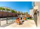 Backyard oasis featuring a pool, lounge chairs, a play area, and lush palm trees at 8179 Shale Canyon St, Las Vegas, NV 89139