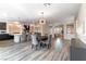 This spacious open floor plan features wood floors, an eat in kitchen, stainless appliances and custom lighting at 8179 Shale Canyon St, Las Vegas, NV 89139