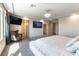 Luxurious main bedroom with TV, large window, closet and ensuite bathroom at 8179 Shale Canyon St, Las Vegas, NV 89139