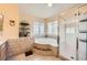 Bright primary bathroom with a glass shower and a large soaking tub at 8324 Brittany Harbor Dr, Las Vegas, NV 89128