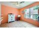 Bright bedroom with a vintage sewing machine, colorful dresser, and tiled floors at 8324 Brittany Harbor Dr, Las Vegas, NV 89128