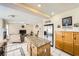 Open kitchen with granite countertops and stainless steel refrigerator, flowing into the adjacent living area at 8324 Brittany Harbor Dr, Las Vegas, NV 89128