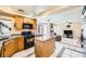 Bright kitchen with granite countertops, island seating, stainless steel appliances and access to living area at 8324 Brittany Harbor Dr, Las Vegas, NV 89128
