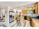 Bright kitchen featuring stainless steel appliances, granite countertops, island with seating, and tile floors at 8324 Brittany Harbor Dr, Las Vegas, NV 89128