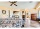 Primary bedroom featuring hardwood floors and an ensuite bathroom with a luxurious soaking tub at 8324 Brittany Harbor Dr, Las Vegas, NV 89128