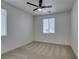 Bedroom with neutral carpet, ceiling fan, and two windows offering natural light at 844 Aurelie Ridge St, Henderson, NV 89011