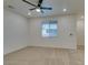 Empty bedroom with carpet, ceiling fan, and window at 844 Aurelie Ridge St, Henderson, NV 89011
