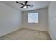 Bright bedroom featuring neutral carpet and a large window for natural light at 844 Aurelie Ridge St, Henderson, NV 89011
