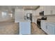 Open kitchen featuring an island, stainless appliances, gas range, and bright white cabinets at 844 Aurelie Ridge St, Henderson, NV 89011