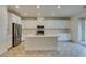 Kitchen features stainless appliances, an island with sink, and ample counter space for cooking at 844 Aurelie Ridge St, Henderson, NV 89011