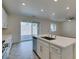 Kitchen island featuring stainless dishwasher, sink, and quartz countertop at 844 Aurelie Ridge St, Henderson, NV 89011