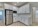 Kitchen with stainless steel appliances and sleek white cabinetry, with easy access at 844 Aurelie Ridge St, Henderson, NV 89011