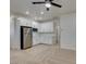Modern mini kitchen featuring stainless steel appliances and sleek white cabinetry at 844 Aurelie Ridge St, Henderson, NV 89011