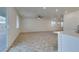 Open floorplan featuring living room with carpet and kitchen at 844 Aurelie Ridge St, Henderson, NV 89011