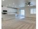 Open concept living room with a ceiling fan and sliding glass doors to the patio at 844 Aurelie Ridge St, Henderson, NV 89011