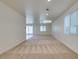 Spacious living room with carpeted floors, recessed lighting, ceiling fan and sliding glass door to backyard at 844 Aurelie Ridge St, Henderson, NV 89011