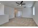 Spacious carpeted living area with abundant natural light and an open layout at 844 Aurelie Ridge St, Henderson, NV 89011