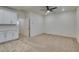 Open floor plan showcasing a versatile living area, with a mini kitchen with white cabinets at 844 Aurelie Ridge St, Henderson, NV 89011
