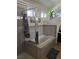 Modern bathroom features a soaking tub, tiled walls and bright natural light at 853 Rusty Anchor Way, Henderson, NV 89002