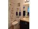 Well-lit bathroom with sink, toilet, and shower-tub combo at 853 Rusty Anchor Way, Henderson, NV 89002
