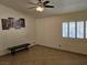 Bedroom featuring a window with white shutters and a ceiling fan at 853 Rusty Anchor Way, Henderson, NV 89002