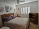 Cozy bedroom with a queen-size bed, window with blinds, and wooden furniture at 853 Rusty Anchor Way, Henderson, NV 89002